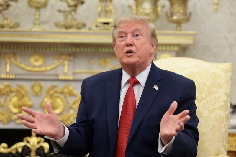 U.S. President Donald Trump speaks as he hosts 16-year-old lifeguard Ryder Williams, who saved a child off the coast of Santa Cruz, California, last month, Nathaniel Rai, the child saved by Williams, and Nathaniel's family members in the Oval Office at the White House in Washington, D.C., U.S., August 17, 2026. REUTERS/Kylie Cooper