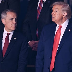 (L-R) Canada's Prime Minister Mark Carney and US President Donald Trump attend the draw for the 2026 FIFA Football World Cup taking place in the US, Canada and Mexico, at the Kennedy Center, in Washington, DC, on December 5, 2025. (Photo by Brendan SMIALOWSKI / AFP via Getty Images)