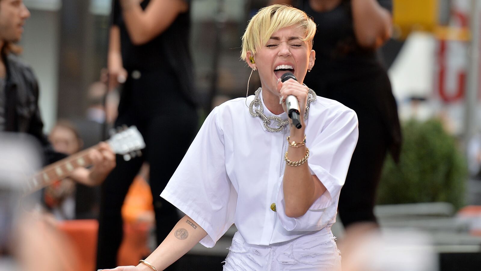 articles/2013/10/08/miley-cyrus-s-craziest-lyrics-from-bangerz-analyzed/131007-zimmerman-miley-tease_czgtx0