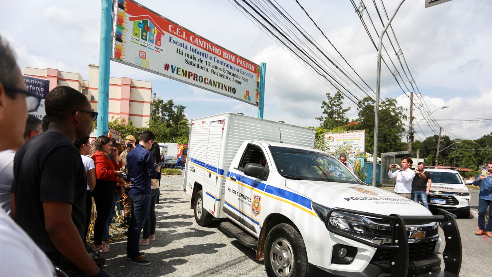 A car with forensic technicians leaves a daycare after a 25-year-old man attacked children, killing several and injuring others, according to local police and hospital, in Blumenau, in the southern Brazilian state of Santa Catarina, Brazil, April 5, 2023.