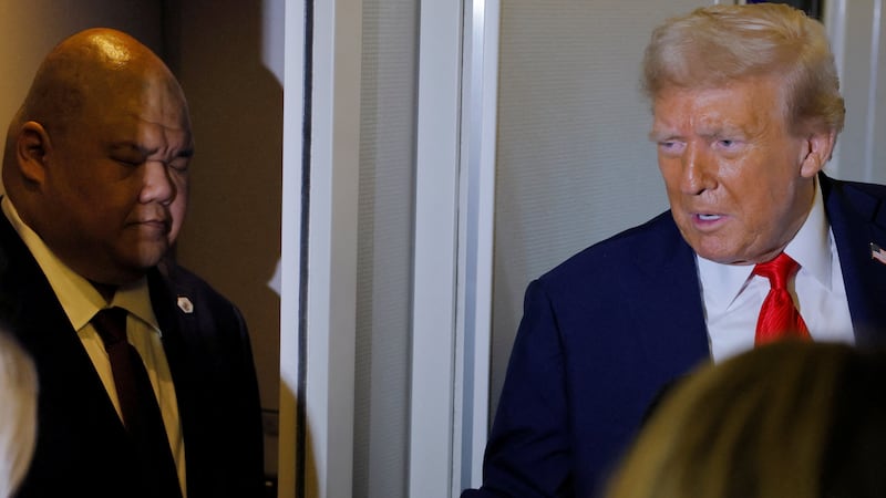 Steven Cheung listens to Donald Trump.