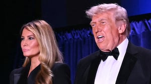 (L/R) White House Press Secretary Karoline Leavitt, US First Lady Melania Trump and US President Donald Trump attend the White House Correspondents' dinner at the Washington Hilton in Washington, DC, on April 25, 2026. President Trump is attending the annual gala of the political press for the first time while in office. (Photo by Mandel NGAN / AFP via Getty Images)