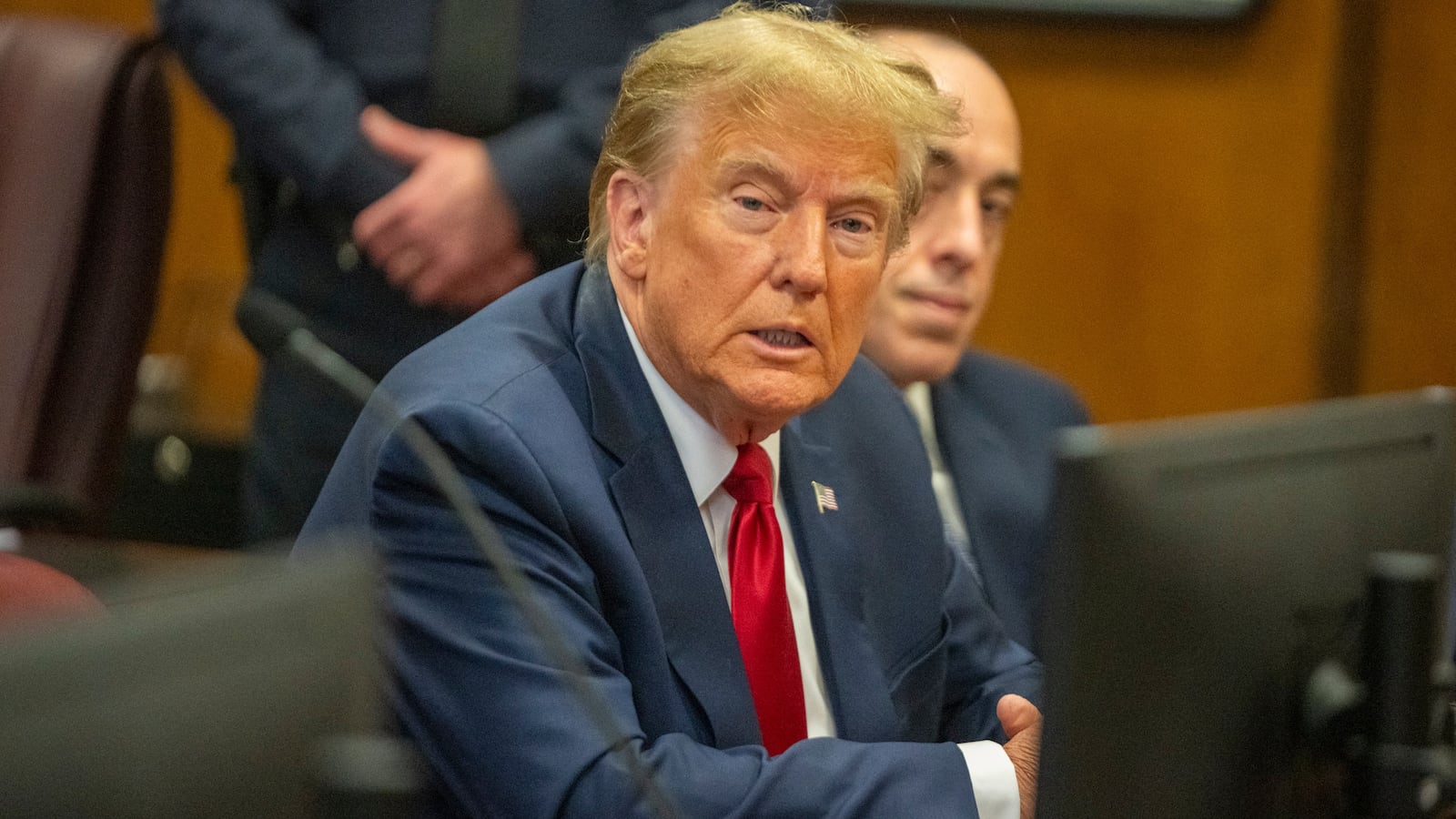 Donald Trump attends a pre-trial hearing at Manhattan Criminal Court.