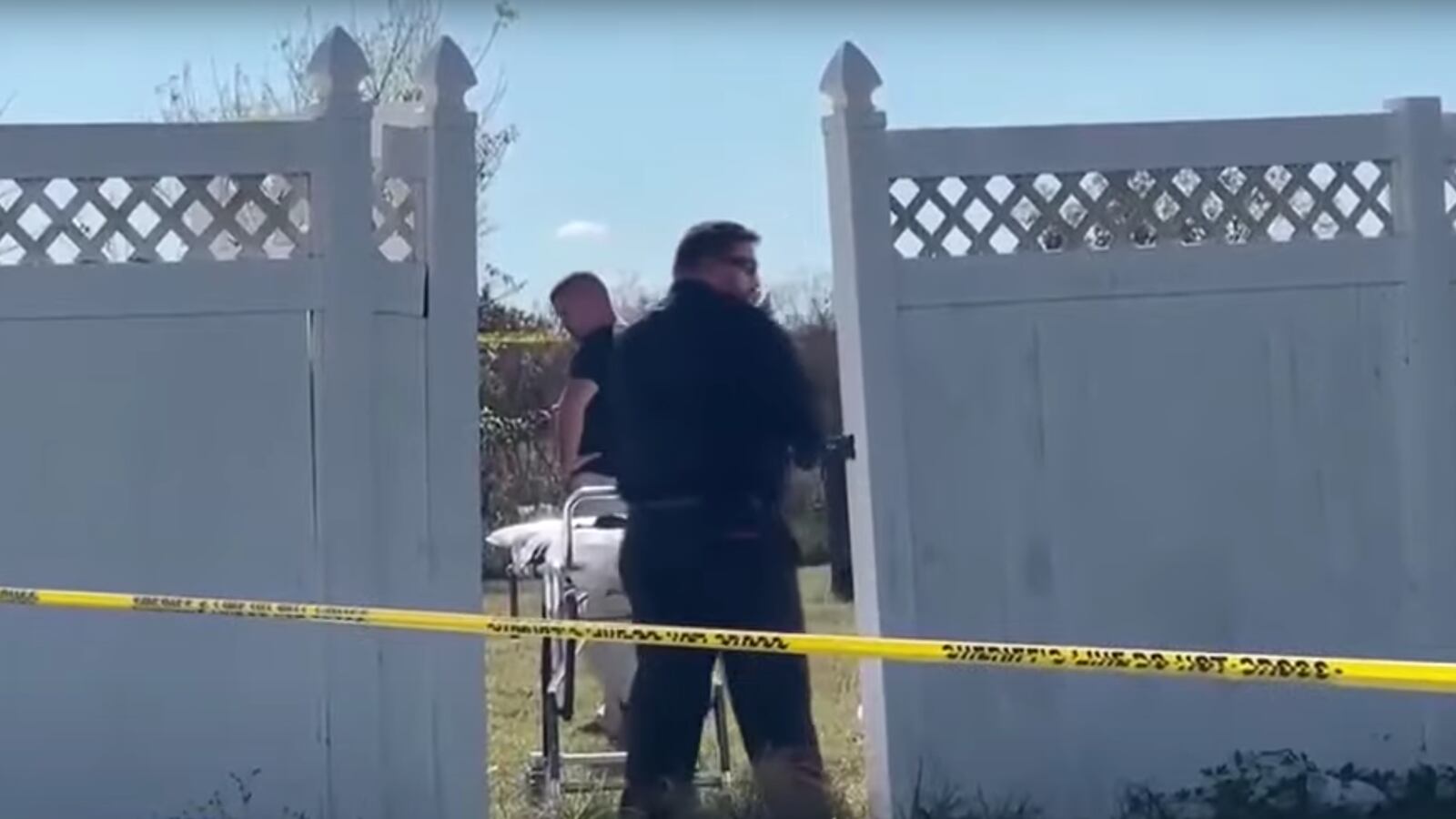 Authorities at the scene where a body was found in a freezer at a home in Headland, Alabama.