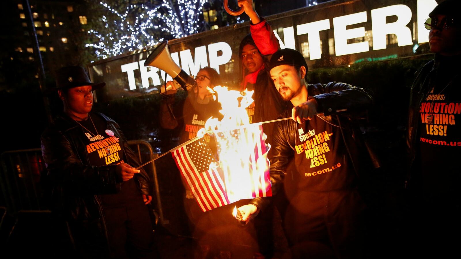 cheats/2016/11/30/activists-burn-flags-outside-trump-hotel/161129-flag-burning-trump-hotel-cheat_hunihu