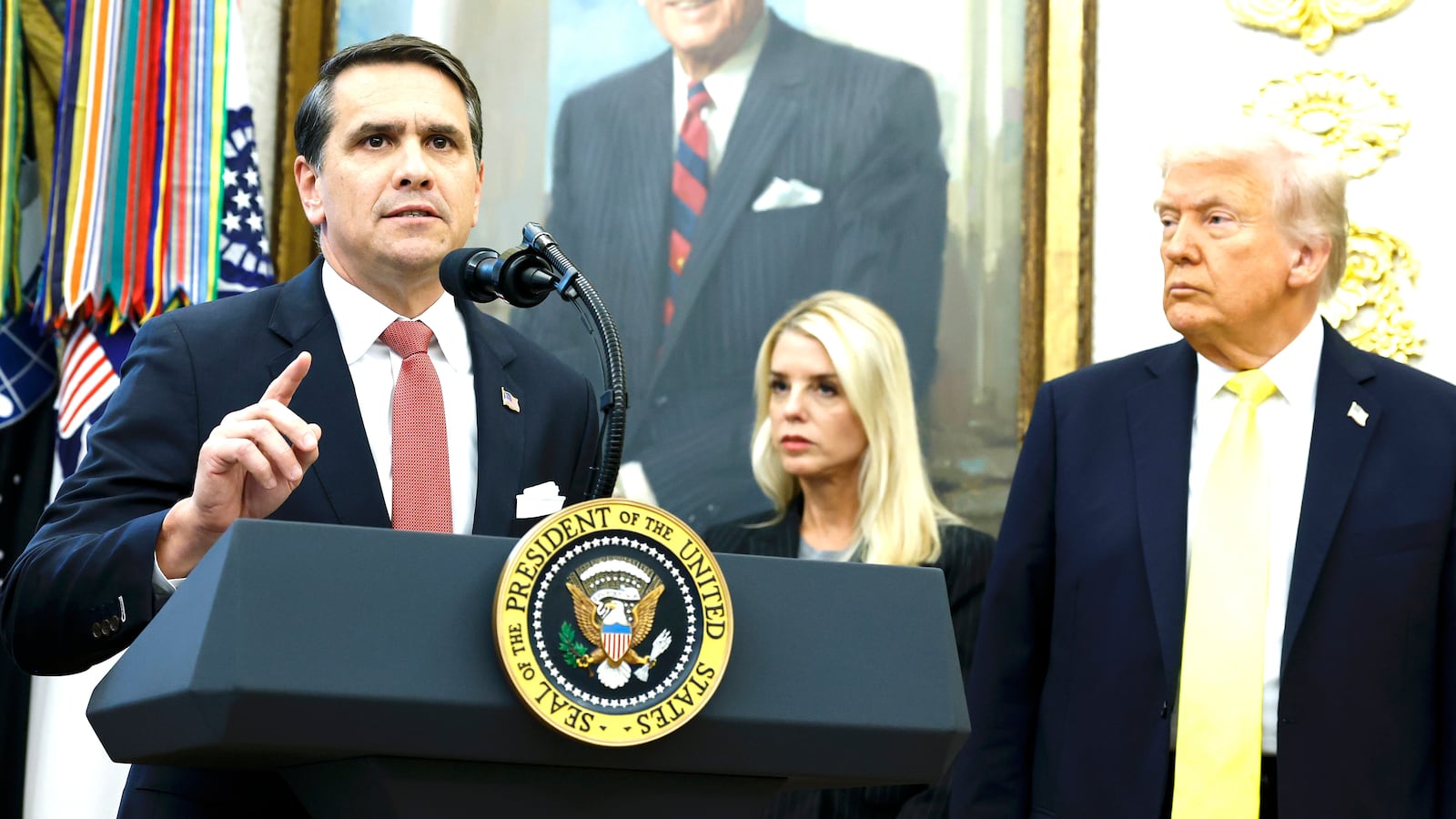 U.S. Deputy Attorney General Todd Blanche (L) speaks as U.S. Attorney General Pam Bondi (C) and U.S. President Donald Trump look on during a press conference