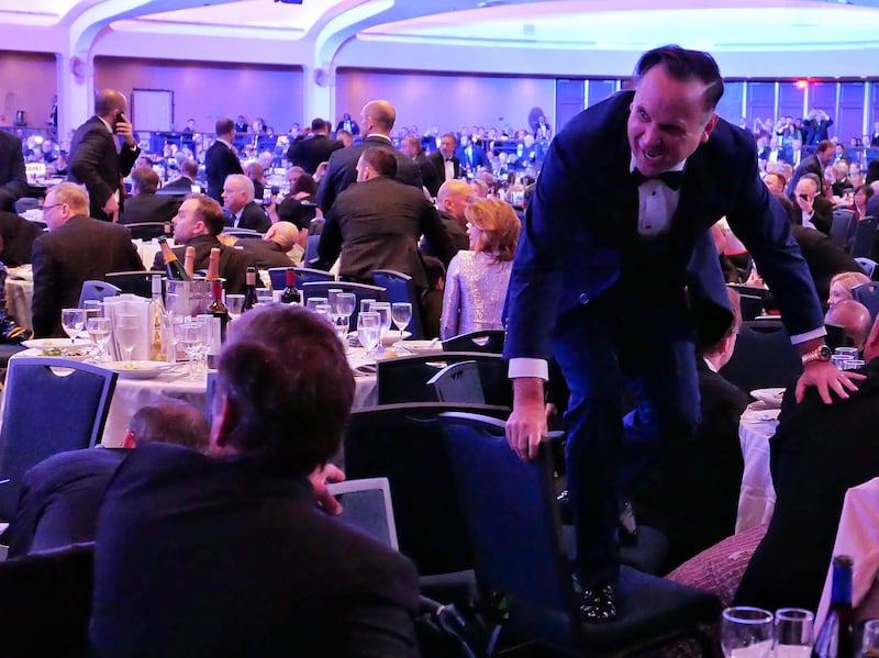Dan Scavino jumps over a chair after an incident at the annual White House Correspondents Association Dinner April 25, 2026 in Washington, DC.