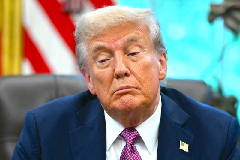 Donald Trump speaks to reporters after signing executive orders in the Oval Office of the White House in Washington, DC on September 5, 2025. )