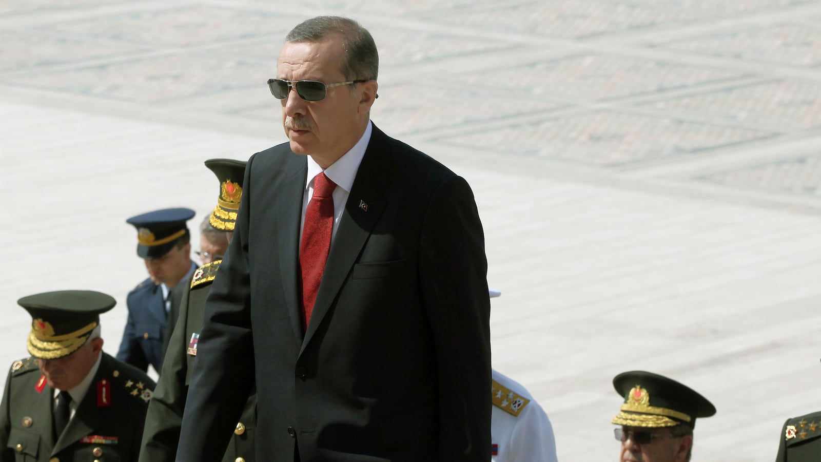 articles/2013/12/18/turkey-sacks-police-chiefs-after-arrests-target-politicians-families/131218-seibert-erdogan_acb7f1