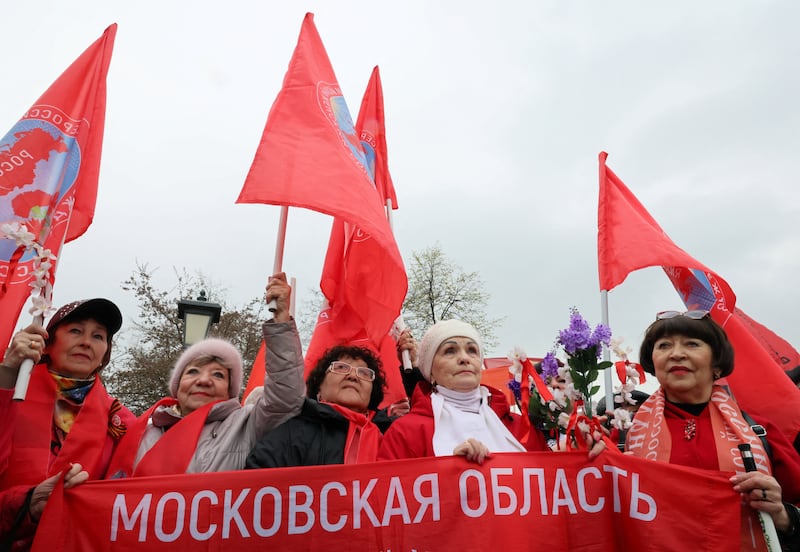 Supporters of the Russian Communist Party attend a May Day rally in Moscow, Russia May 1, 2026. The banner reads: "Moscow Region". REUTERS/Anastasia Barashkova