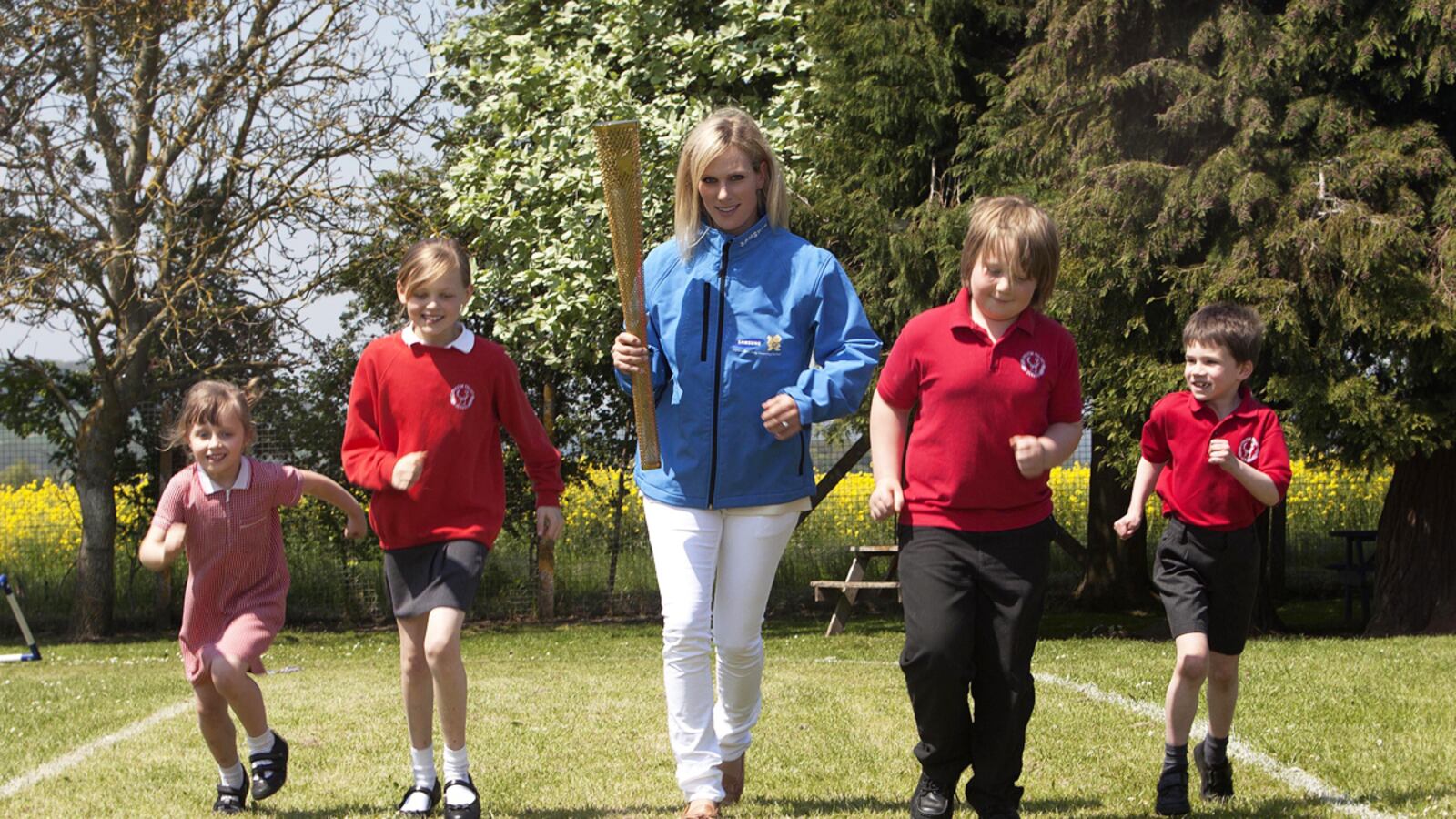 cheats/2012/06/11/zara-phillips-nominated-for-olympics/zara-phillips-torch-royalist_eeagvx