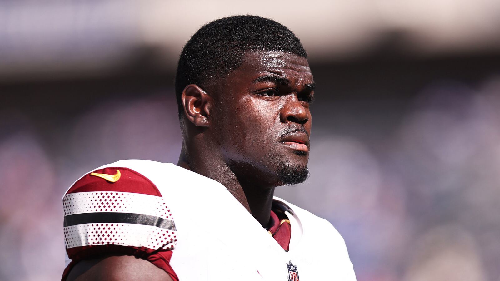 A photograph of Jamin Davis #52 of the Washington Commanders looking on prior to game in 2023.