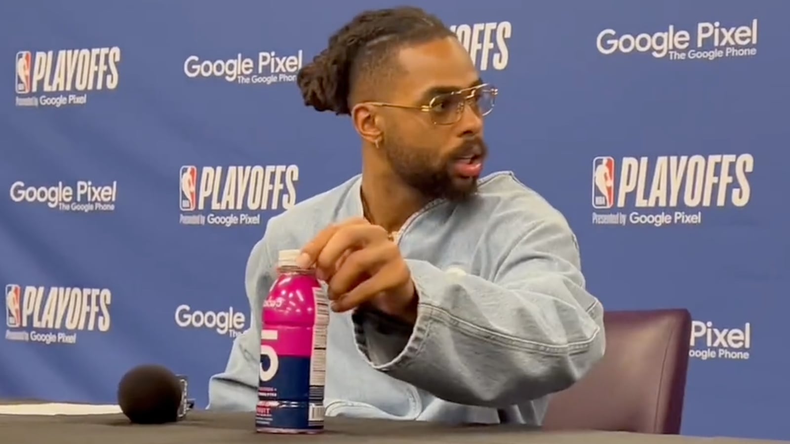 D’Angelo Russell refusing to remove a bottle of Coco5 from display during a press conference.