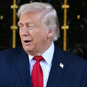 US President Donald Trump (R) greets Israeli Prime Minister Benjamin Netanyahu (L) upon arrival at Trump's Mar-a-Lago residence in Palm Beach, Florida, on December 29, 2025.