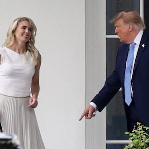 US President Donald Trump and his executive assistant Natalie Harp return from an America.gov AI event to the Oval Office at the White House in Washington, D.C., US, September 29, 2026. REUTERS/Jonathan Ernst