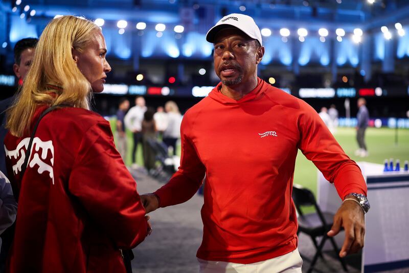 Tiger Woods of Jupiter Links GC talks with his girlfriend, Vanessa Trump, after a match against Boston Common Golf  at SoFi Center on March 17, 2026 in Palm Beach Gardens, Florida.