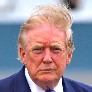 U.S. President Donald Trump waves after disembarking Marine One at Morristown Municipal Airport in Morristown, New Jersey, U.S., August 2, 2026.