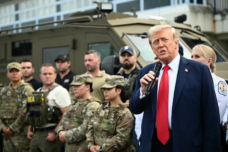 US President Donald Trump speaks while visiting federal troops at the US Park Police Anacostia operations facility in Washington, DC, on August 21, 2025. Trump said he plans to patrol Washington's streets on Thursday with troops he deployed to the US capital in a show of force against what he claims is a "crime emergency." Trump ordered hundreds of National Guard to deploy in Washington last week vowing to "take our capital back," despite protests by some residents and statistics showing violent offenses falling. (Photo by Mandel NGAN / AFP) (Photo by MANDEL NGAN/AFP via Getty Images)