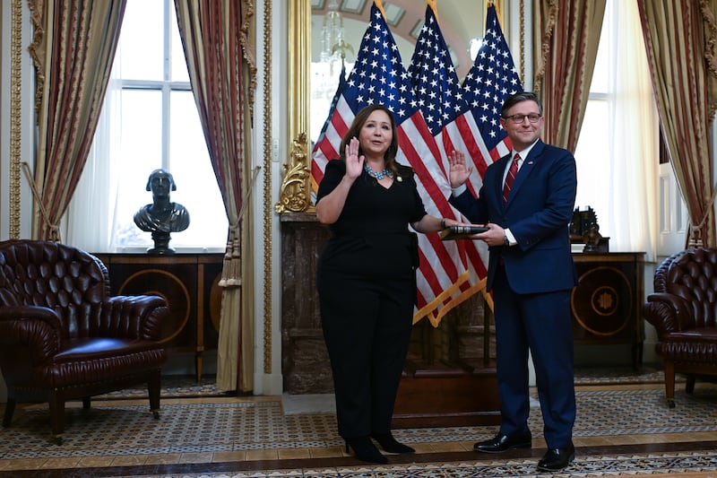 Speaker of the House Mike Johnson (R-LA) takes part in a ceremonial swearing in event with U.S. Representative Adelita Grijalva (D-AZ) at the United States Capitol on Wednesday November 12, 2025 in Washington, DC. The House is expected to vote on a bill that could reopen the federal government and end the government shutdown.