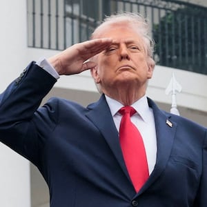 U.S. President Donald Trump salutes next to Britain's King Charles III during an arrival ceremony on the South Lawn of the White House in Washington, D.C., U.S., April 28, 2026. REUTERS/Jonathan Ernst