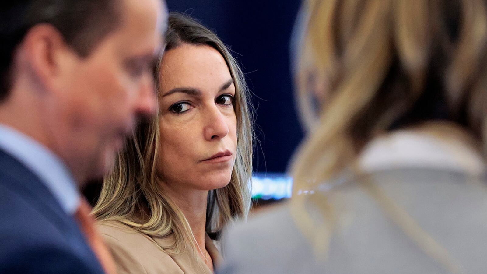 Karen Read is flanked by defense attorneys Alan Jackson and Elizabeth Little at the start of a recess at Norfolk Superior Court.