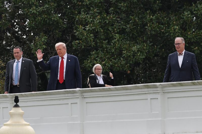 President Trump's wander of the White House roof offered few answers on what his plans were.