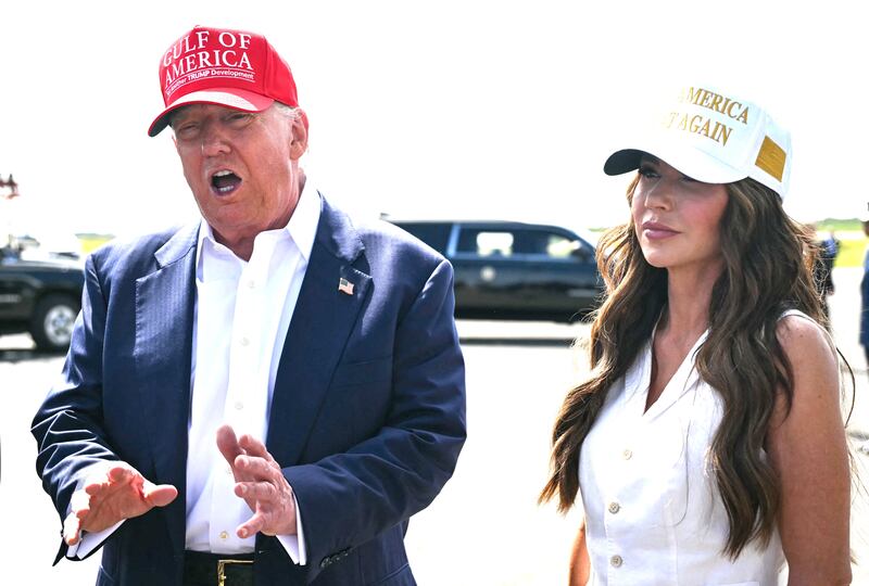 US President Donald Trump, alongside Secretary of Homeland Security Kristi Noem