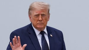 President Donald Trump gestures on the tarmac, as he heads to board the new Qatari-gifted Air Force One en route to New York City, at Joint Base Andrews, Maryland on July 17, 2026.
