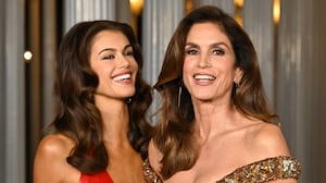 Kaia Gerber and Cindy Crawford pose, smiling and giggling, at the 2025 LACMA Art + Film Gala.