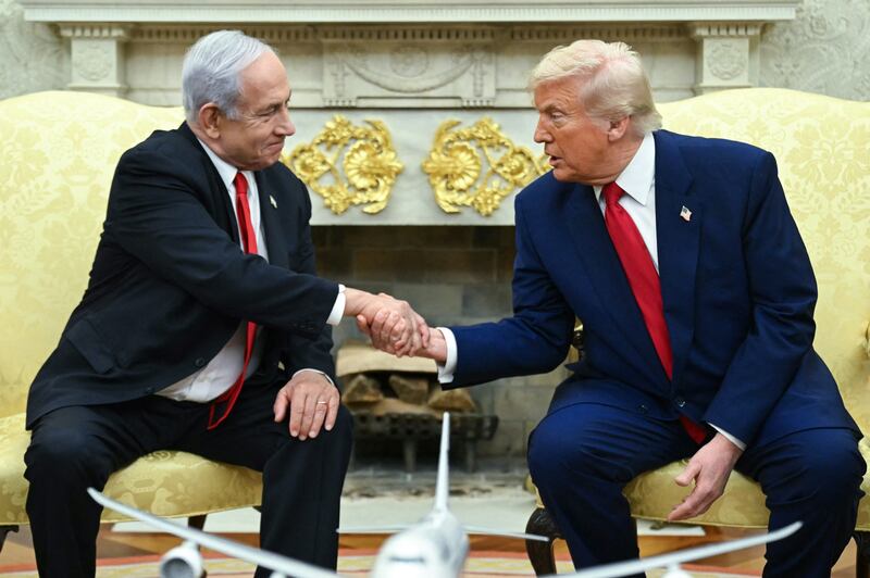 Donald Trump shakes hands with Israeli Prime Minister Benjamin Netanyahu during a meeting in the Oval Office of the White House in Washington, DC, on April 7, 2025.