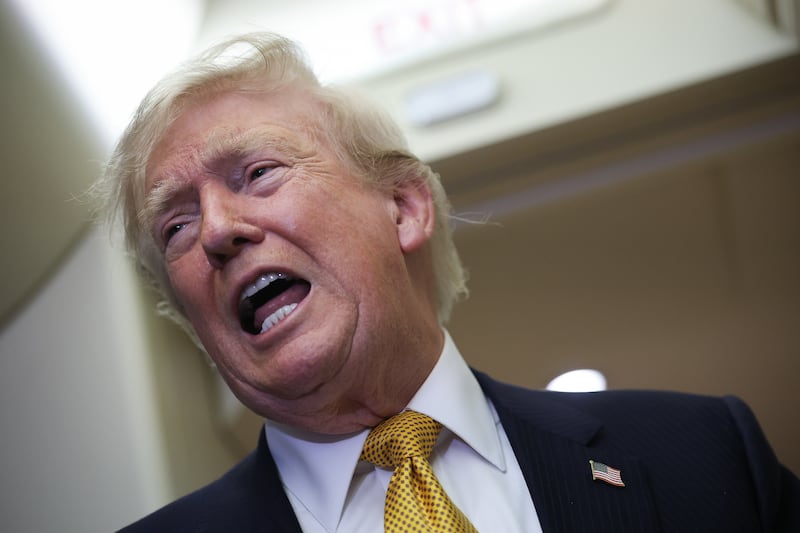 U.S. President Donald Trump speaks to members of the press for the first time aboard the new Air Force One while in flight from RAF Mildenhall AFB to Joint Base Andrews July 8, 2026 after leaving the United Kingdom.