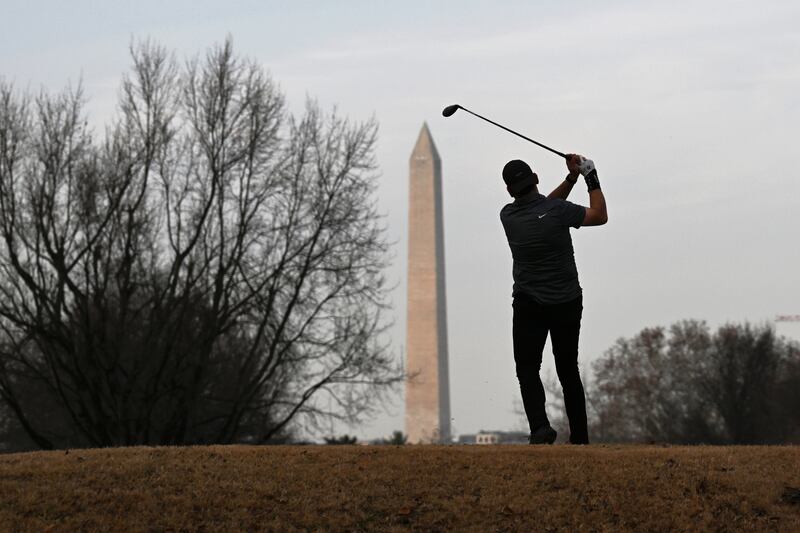 A man golfs at the East Potomac Golf Links.