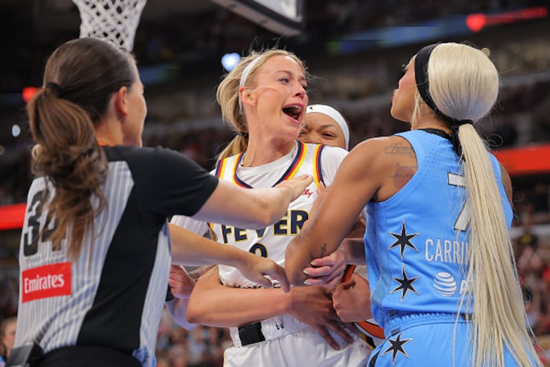 Sophie Cunningham charged at her opponent, DiJonai Carrington, after she was hit in the face in a foul that led to Carrington's ejection.