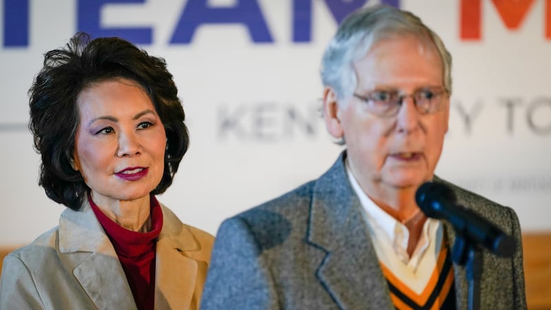 U.S. Secretary of Transportation Elaine Chao stands with her husband, Senate Majority Leader Mitch McConnell, at his final campaign event of the 2020 campaign for U.S. Senate, in Versailles, Kentucky, U.S., November 2, 2020. Picture taken November 2, 2020.  REUTERS/Bryan Woolston