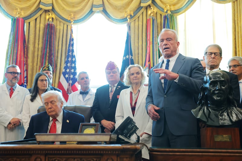 WASHINGTON, DC - DECEMBER 18: U.S. Health and Human Services Secretary Robert F. Kennedy Jr. speaks alongside U.S. President Donald Trump during an event for an executive order in the Oval Office of the White House on December 18, 2025 in Washington, DC. Trump signed the order reclassifying marijuana as a schedule III drug. (Photo by )