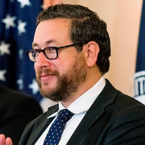 US Citizenship and Immigration Services (USCIS) Deputy Director for Policy Joseph Edlow,(R) and Secretary of State Mike Pompeo, applaud and congratulate new US citizens during a naturalization ceremony hosted by the USCIS at the State Department in Washington, DC, on October 22, 2020.