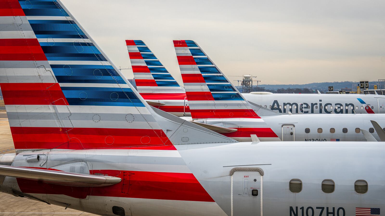 American Airlines passenger jets are lined up on the gates at Washingtons Reagan National Airport on February 10, 2024, in Arlington, VA.