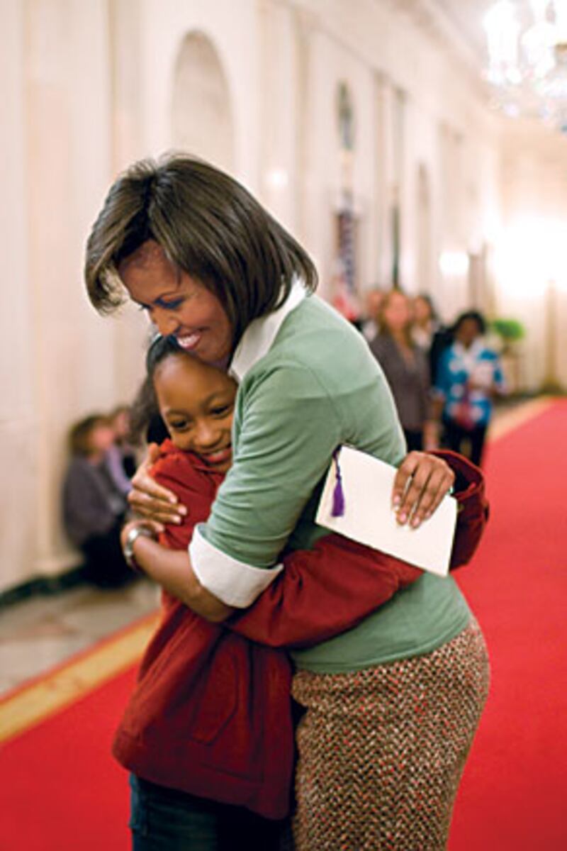 galleries/2009/11/25/a-pictorial-ode-to-michelle-obama/crouch-michelle-obama-2_xbgqzb
