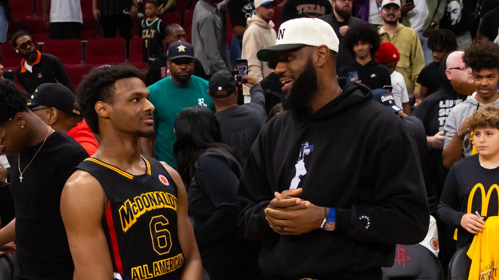 Bronny and LeBron James at a basketball game before the cardiac arrest.