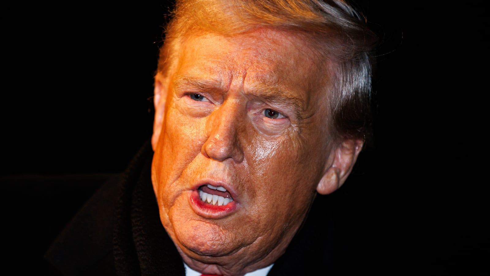 WASHINGTON, DC - JANUARY 20: U.S. President Donald Trump makes a brief statement to reporters before departing from the South Lawn of the White House in Marine One on January 20, 2026 in Washington, DC. President Trump is heading to Switzerland for the Davos Forum as tensions rise around Trumps rhetoric on Greenland. (Photo by Samuel Corum/Getty Images)