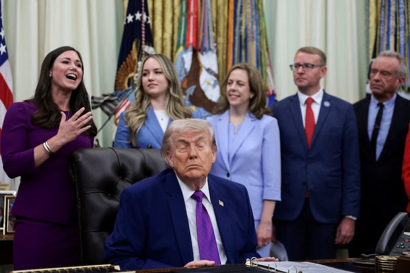 Trump shuts his eyes during Monday's Oval Office event.