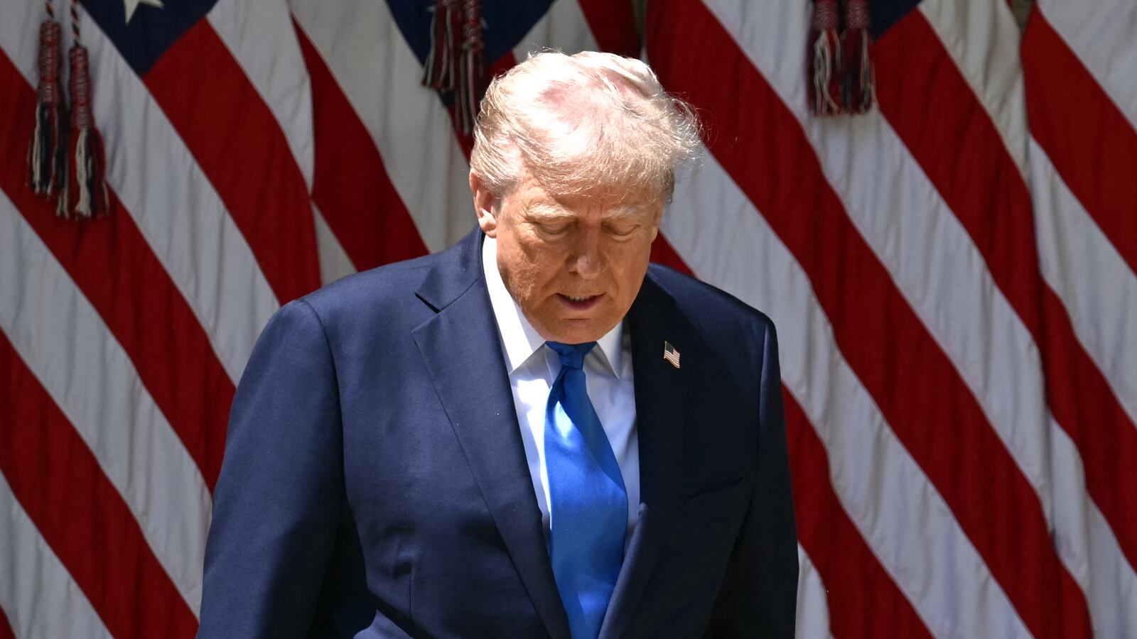 President Donald Trump arrives to speak at a National Day of Prayer event in the Rose Garden of the White House in Washington, DC, on May 1, 2025.