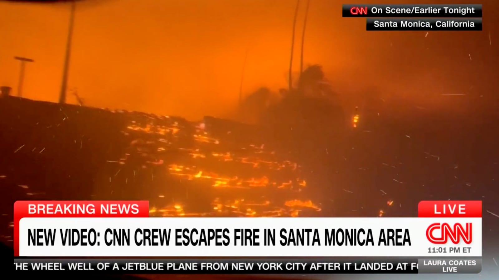 A screenshot from a CNN broadcast shows a raging wildfire in the Los Angeles area on January 7, 2025.