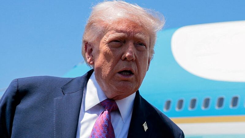U.S. President Donald Trump speaks to the press, as he arrives at Phoenix Sky Harbor International Airport in Phoenix, Arizona, U.S., April 17, 2026.