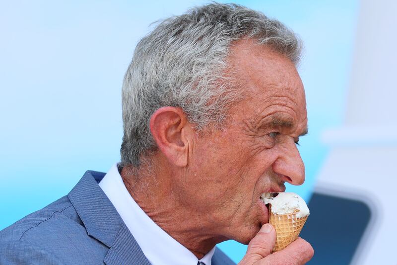 Health and Human Services (HHS) Secretary Robert F. Kennedy Jr. eats a mint chocolate chip ice cream cone during a press conference on the steps of the United States Department of Agriculture on July 14, 2025 in Washington, DC.