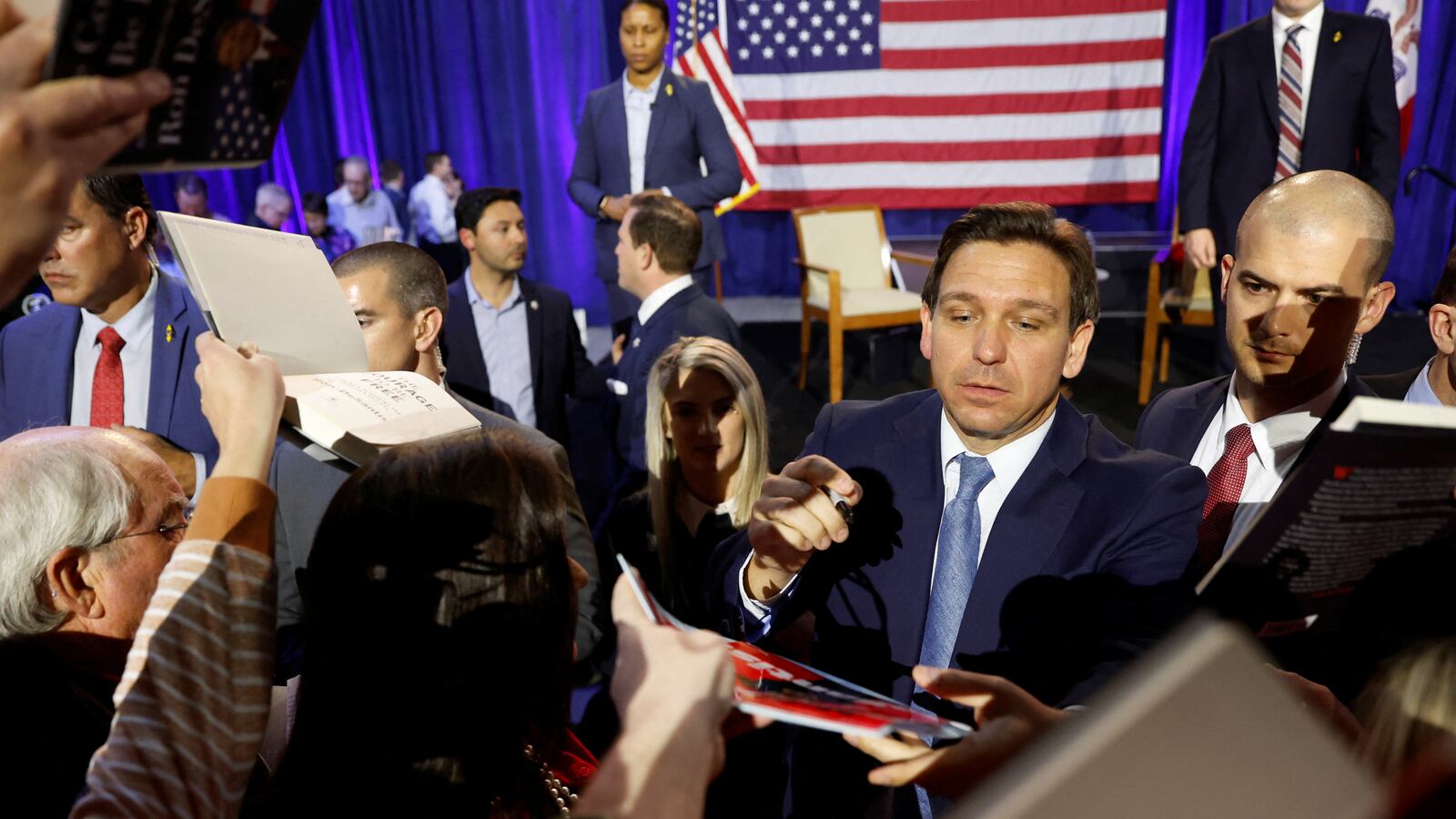 Florida Governor Ron DeSantis greets attendees and signs books in Des Moines, Iowa, March 10, 2023.