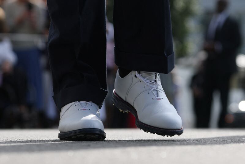 Donald Trump walking up wearing white golf shoes from MyFoot