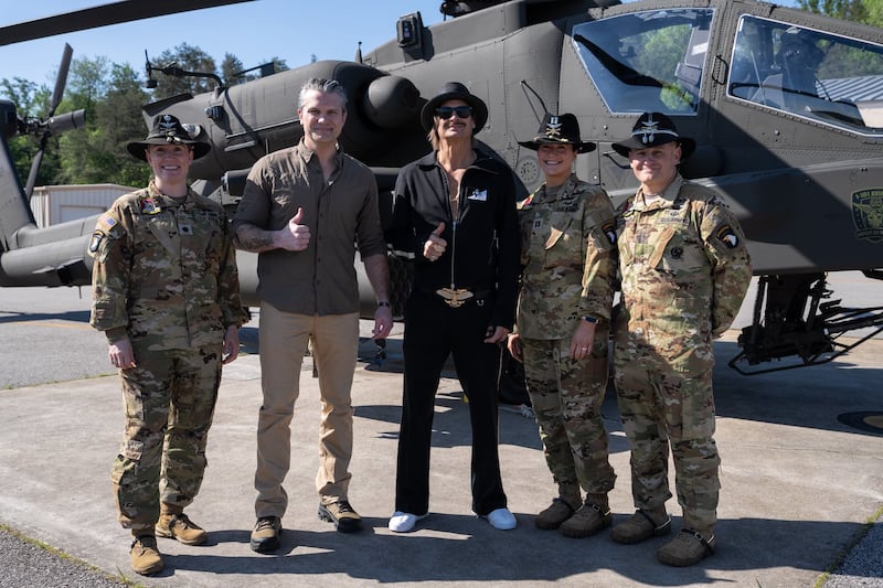 Hegseth and Kid Rock with Apache pilots.