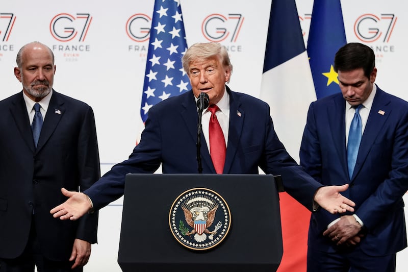 U.S. President Donald Trump, with Commerce Secretary Howard Lutnick and Secretary of State Marco Rubio, holds a press conference during the G7 Summit