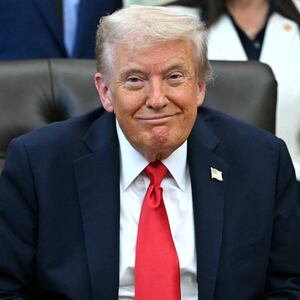 Donald Trump smiles during an announcement in the Oval Office of the White House in Washington, DC, on October 16, 2025.